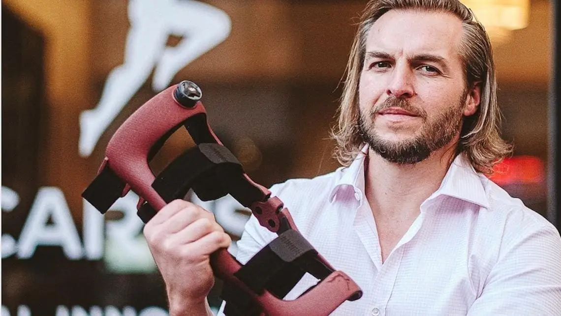 Dave holding a knee brace