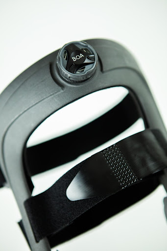 partial view of a knee brace displayed on a white background