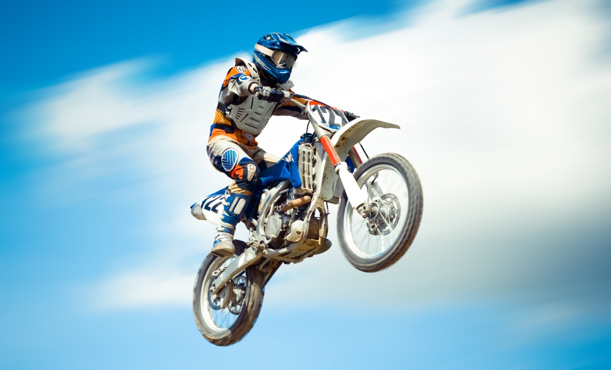 motocross racer soaring through the sky