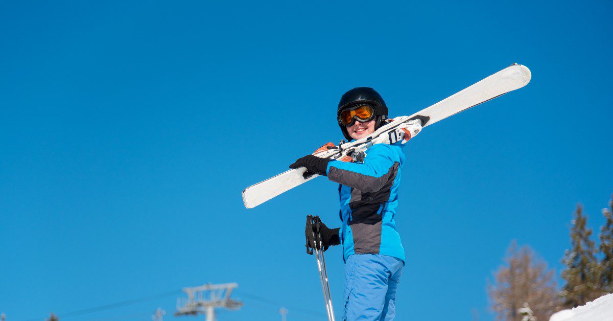 woman in skiing gear on a mountain