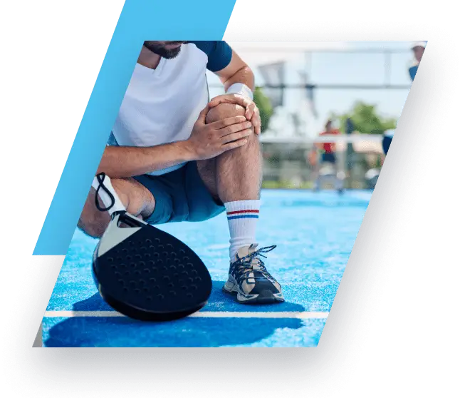 Person holding their knee due to a pickleball injury