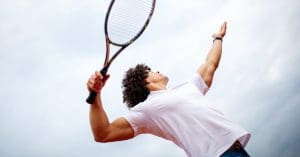 tennis player hitting a ball