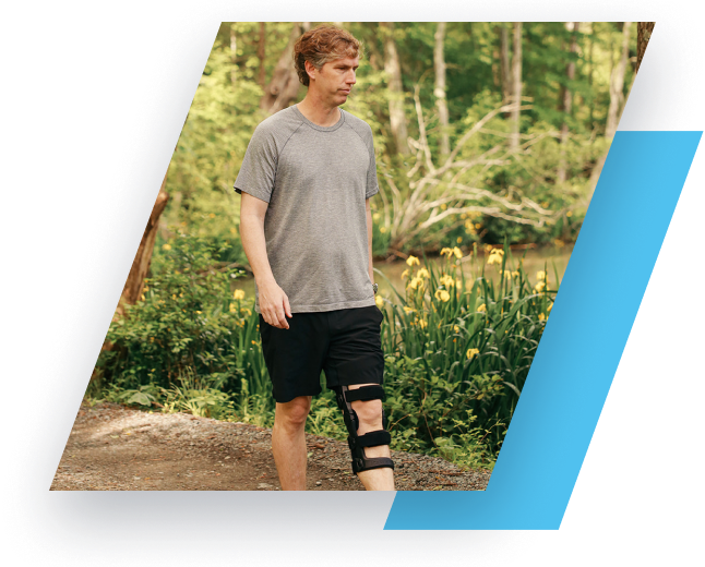 man walking while wearing knee brace