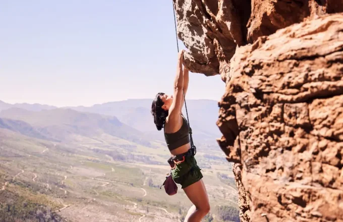 woman rock climbing